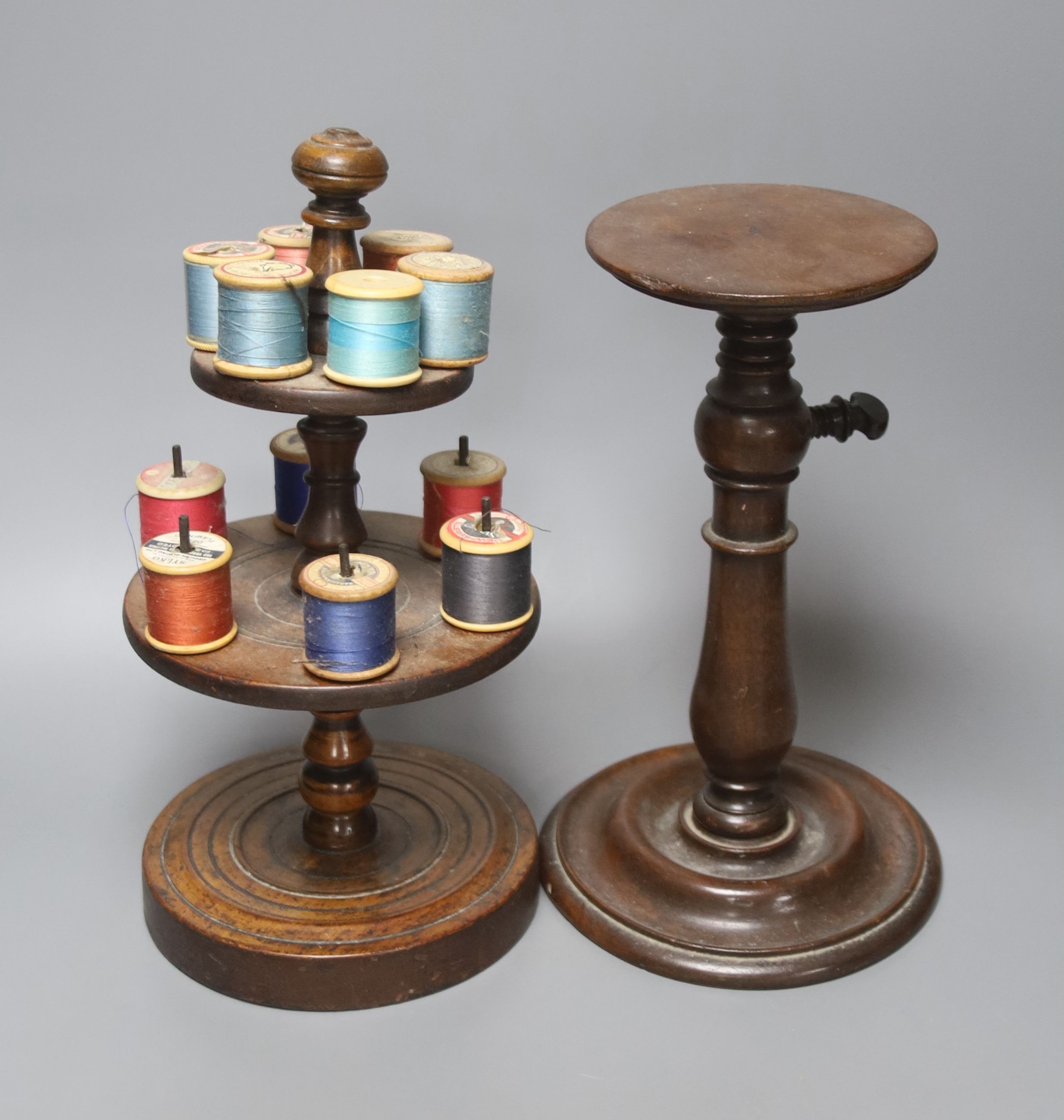 A Victorian turned wood cotton reel stand, 30cm and a 19th century mahogany telescopic candle stand, height 26cm